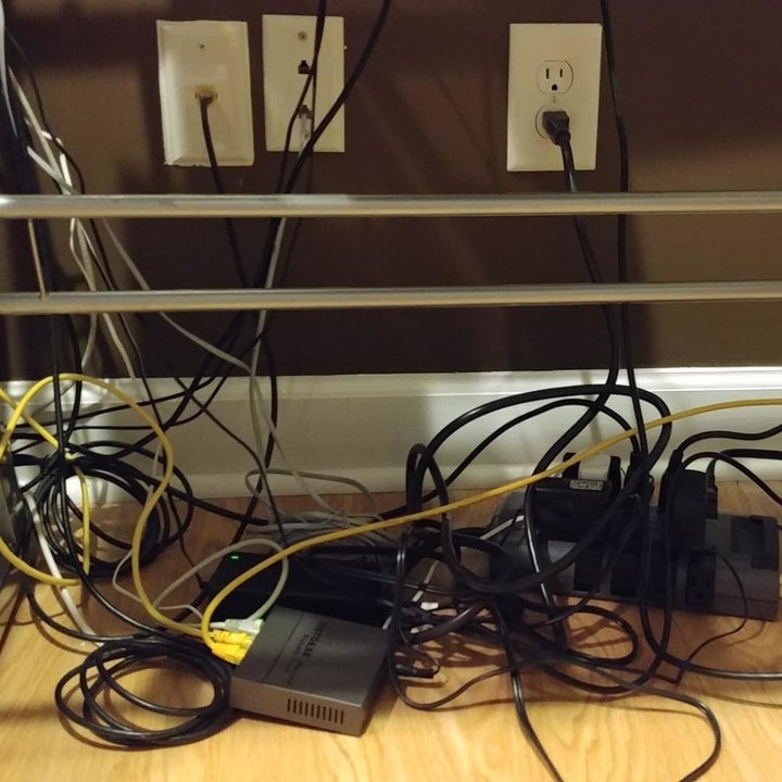 Reviewer showing messy, tangled cords on the floor