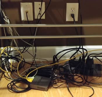 Reviewer showing messy, tangled cords on the floor