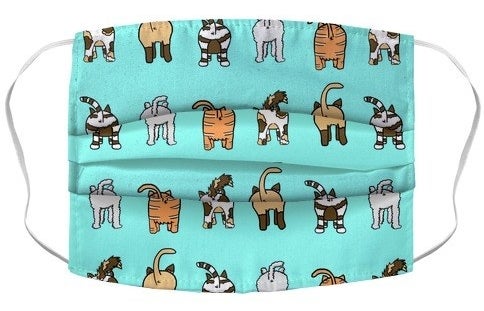 blue mask with cartoon cats showing their butts