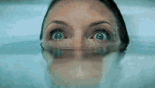 Michelle Pfeiffer in the bathtub as it fills with water