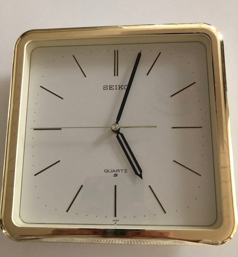 A brass and square Seiko wall clock that is from the &#x27;80s