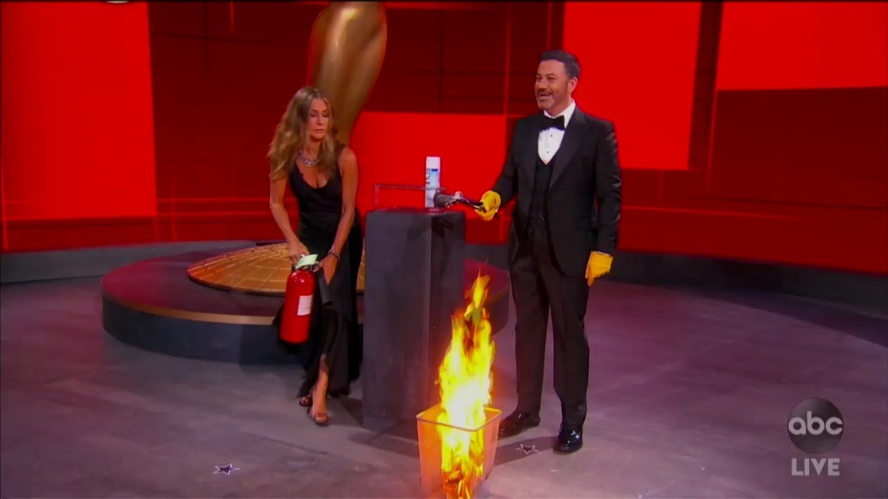Jennifer grabs the fire extinguisher to put out the fire
