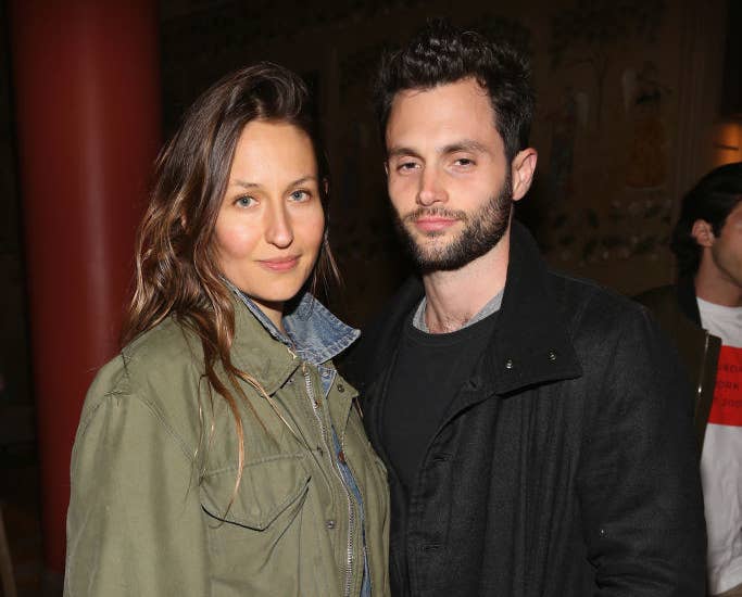 Domino Kirke and Penn Badgley posing at a Hollywood event