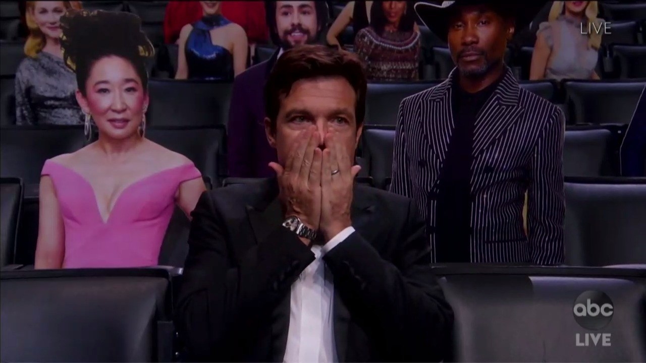 Jason Bateman touching his face