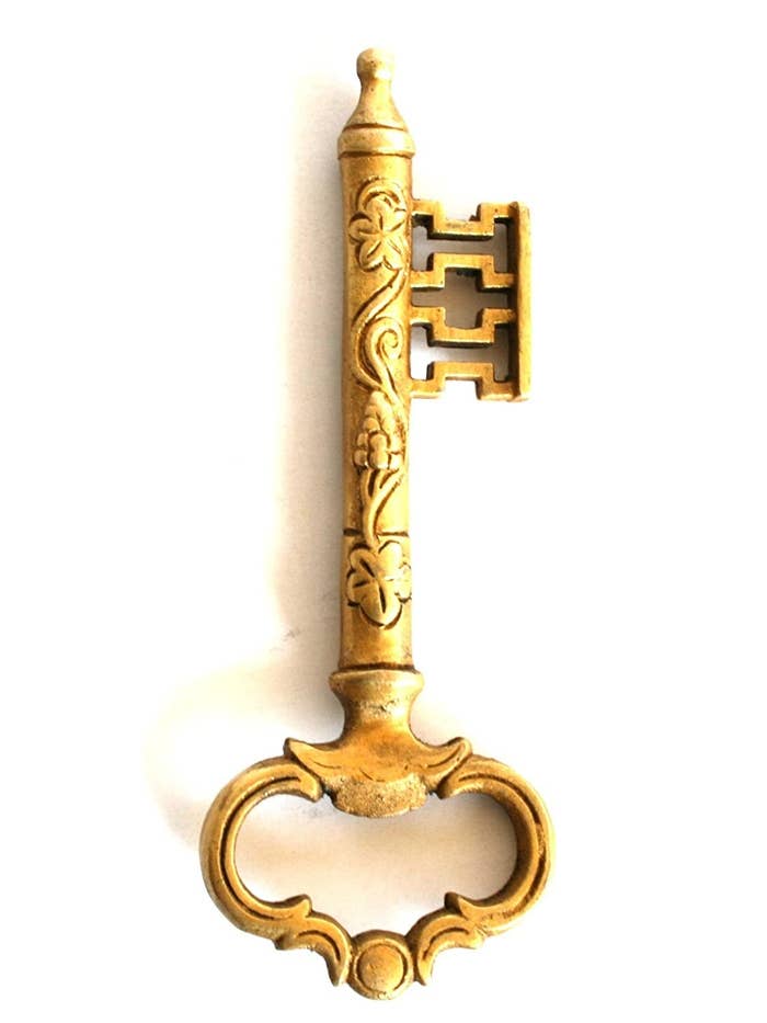 A bottle opener in the shape of an antique key.