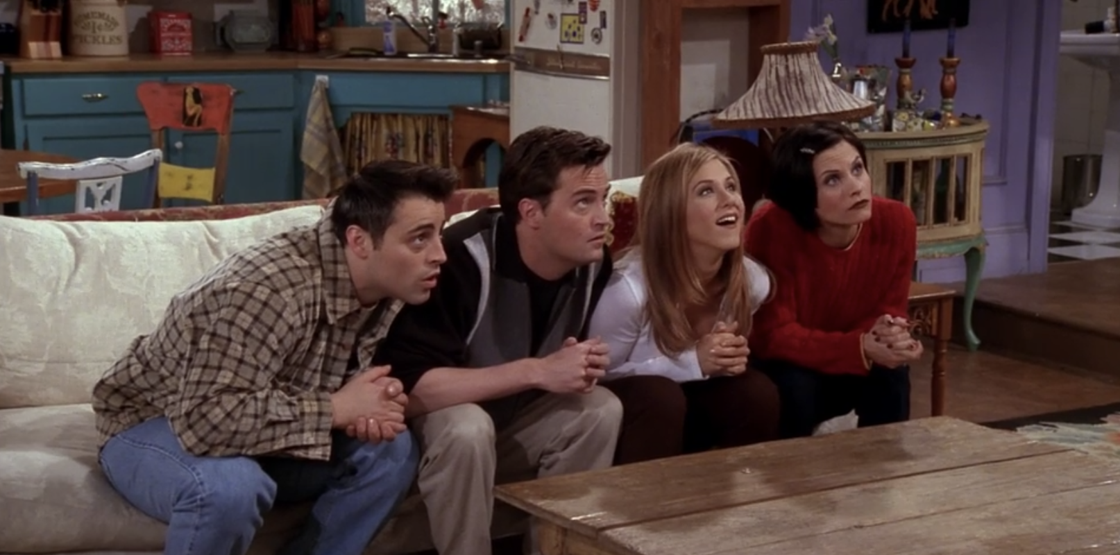 Joey, Chandler, Rachel, and Monica stare blankly at Ross