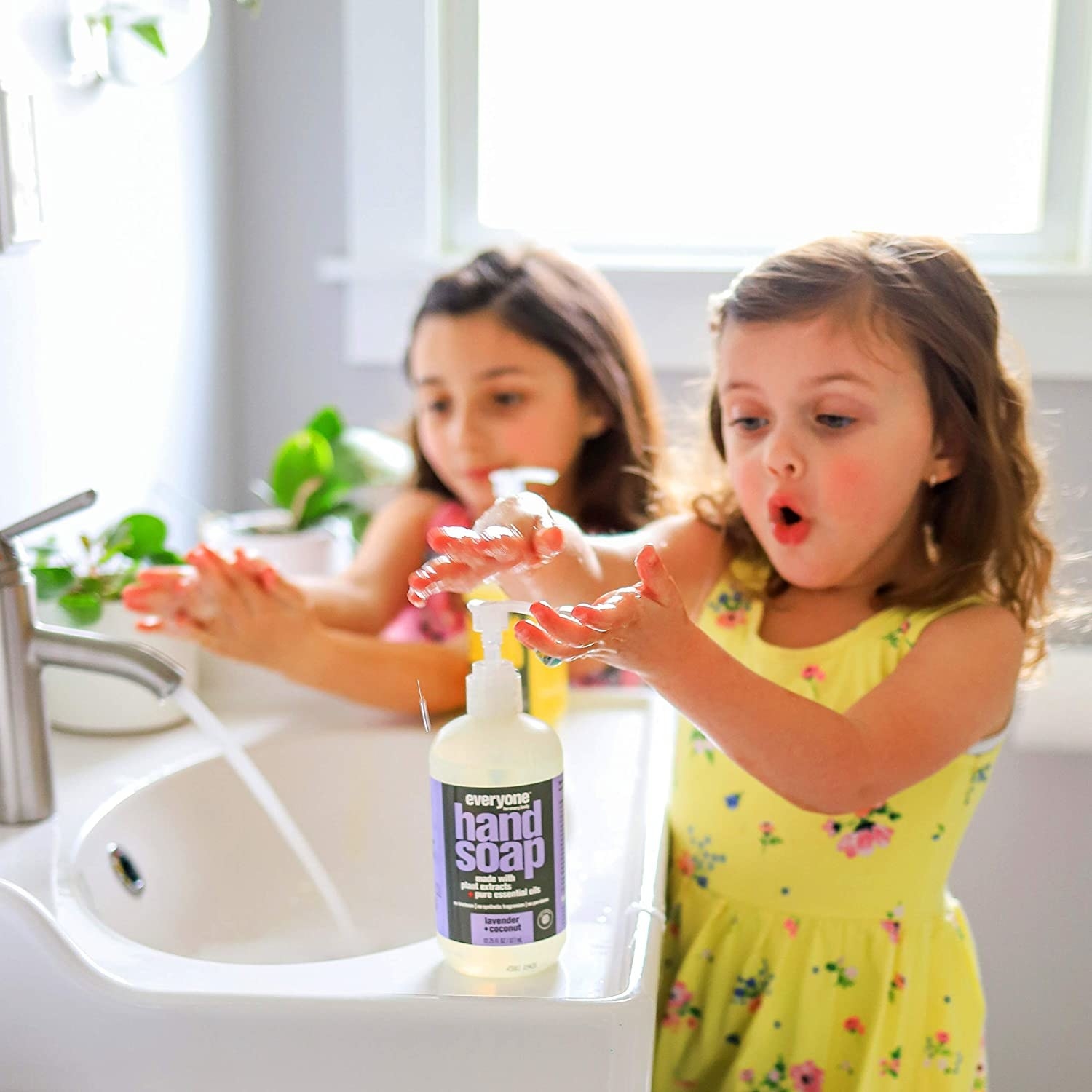 Kids using the nozzle on the soap to dispense it 