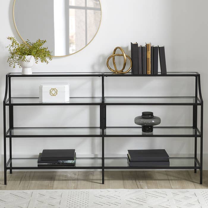 The black iron and glass console table.