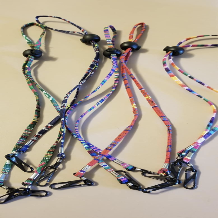 Set of five lanyards in bright colors showing adjustable toggle on the back 