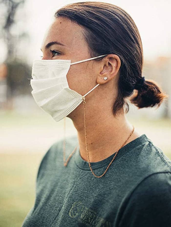 Model in a copper face mask chain 