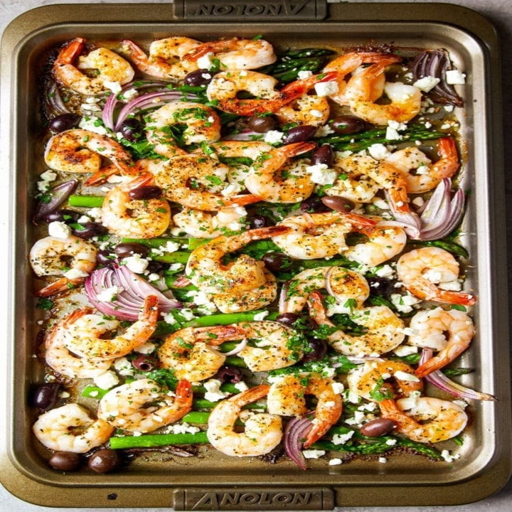 Sheet pan shrimp with asparagus, pepper, red onion, and crumbled feta.