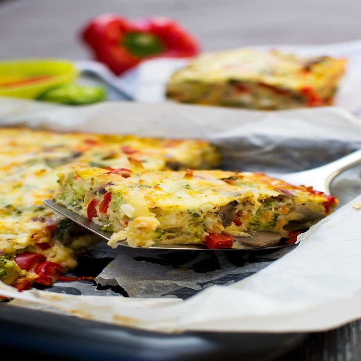 A spatula taking a piece of the everything frittata.