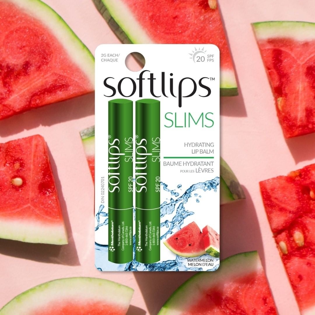 A package with two small tubes of lip balm placed over a background decorated with watermelon slices 