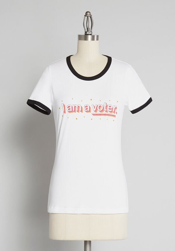 The white and black ringer tee with yellow stars and &quot;I am a voter.&quot; written in pink, yellow, and white