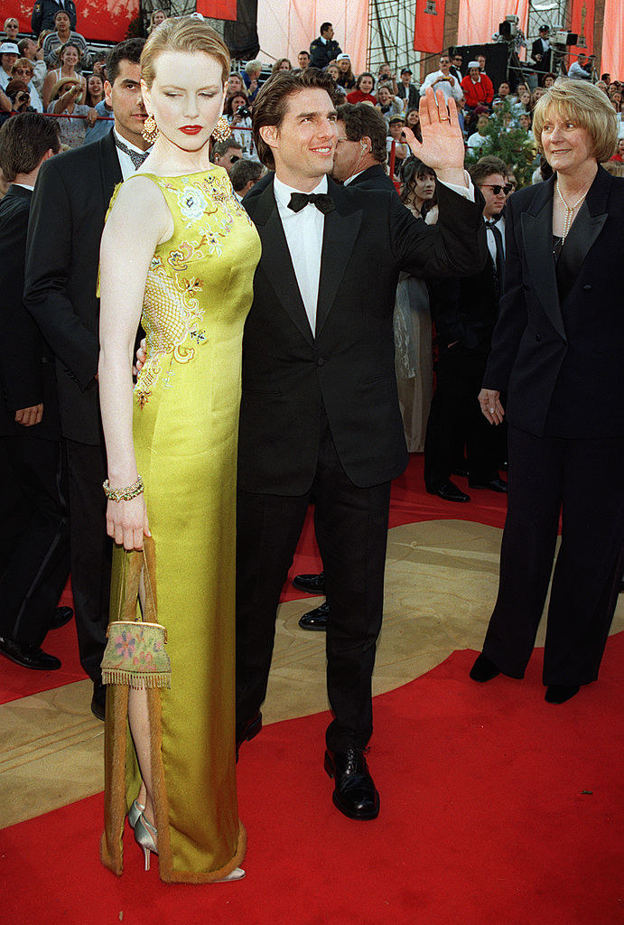 Looking at the floor with Tom Cruise at a formal event