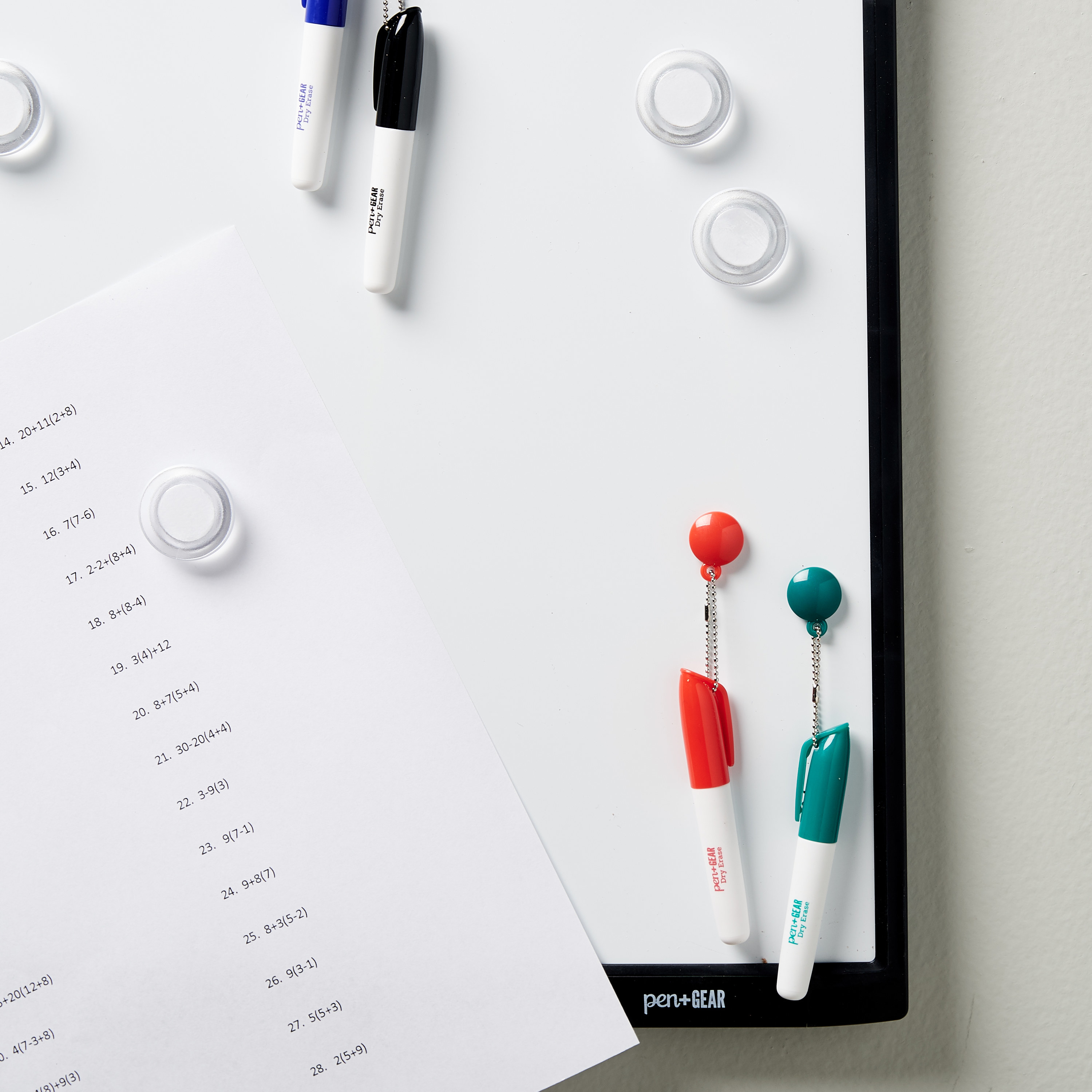 The white and black magnetic dry erase board