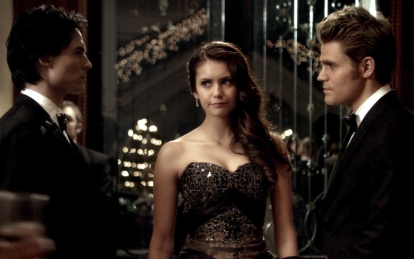 Elena stands between the two vampire brothers who stare at each other