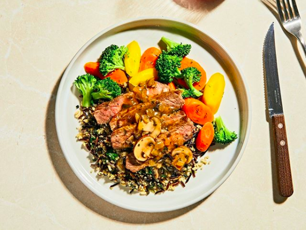 plate of Truffled Mushroom Steak with Spinach &amp;amp; Wild Grain Sauté