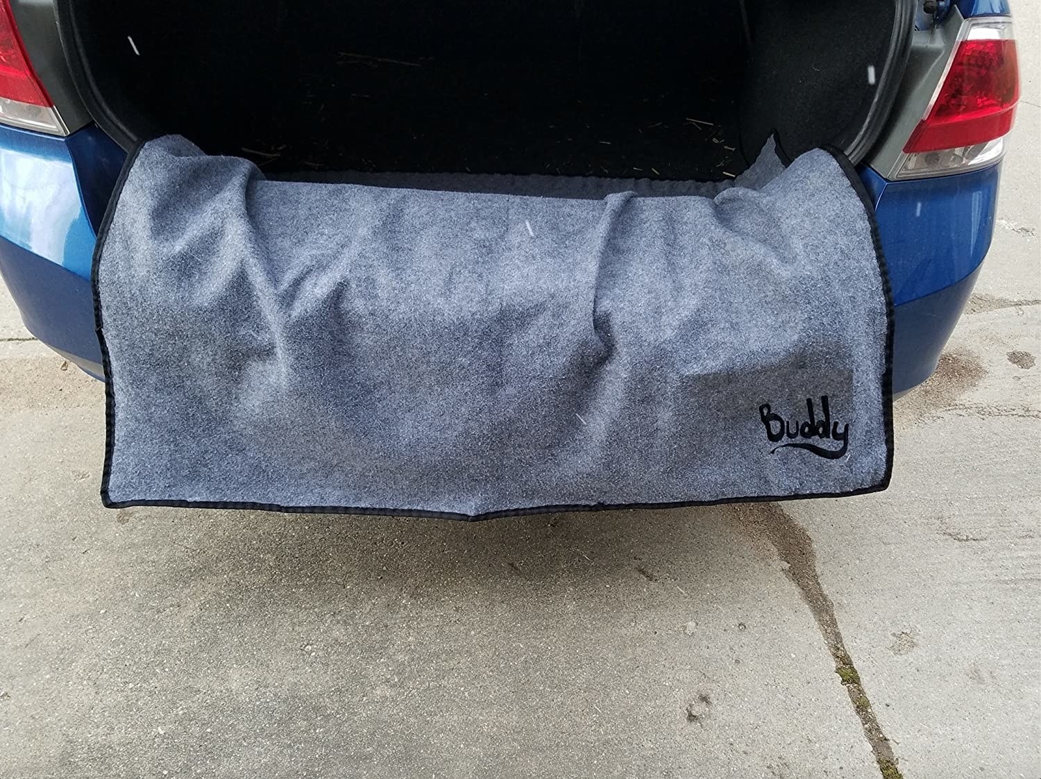 Gray fabric bumper protector covering bumper of car