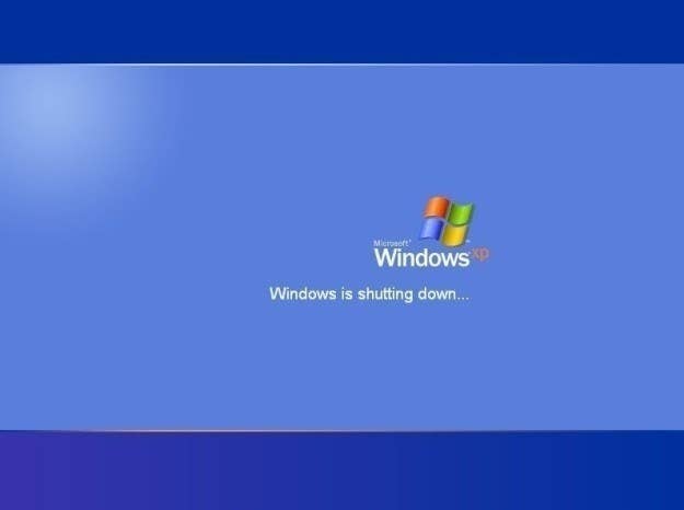 A screenshot of the Windows XP shutting down screen