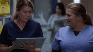 Gif of Taryn Helm walking and talking with Meredith Grey