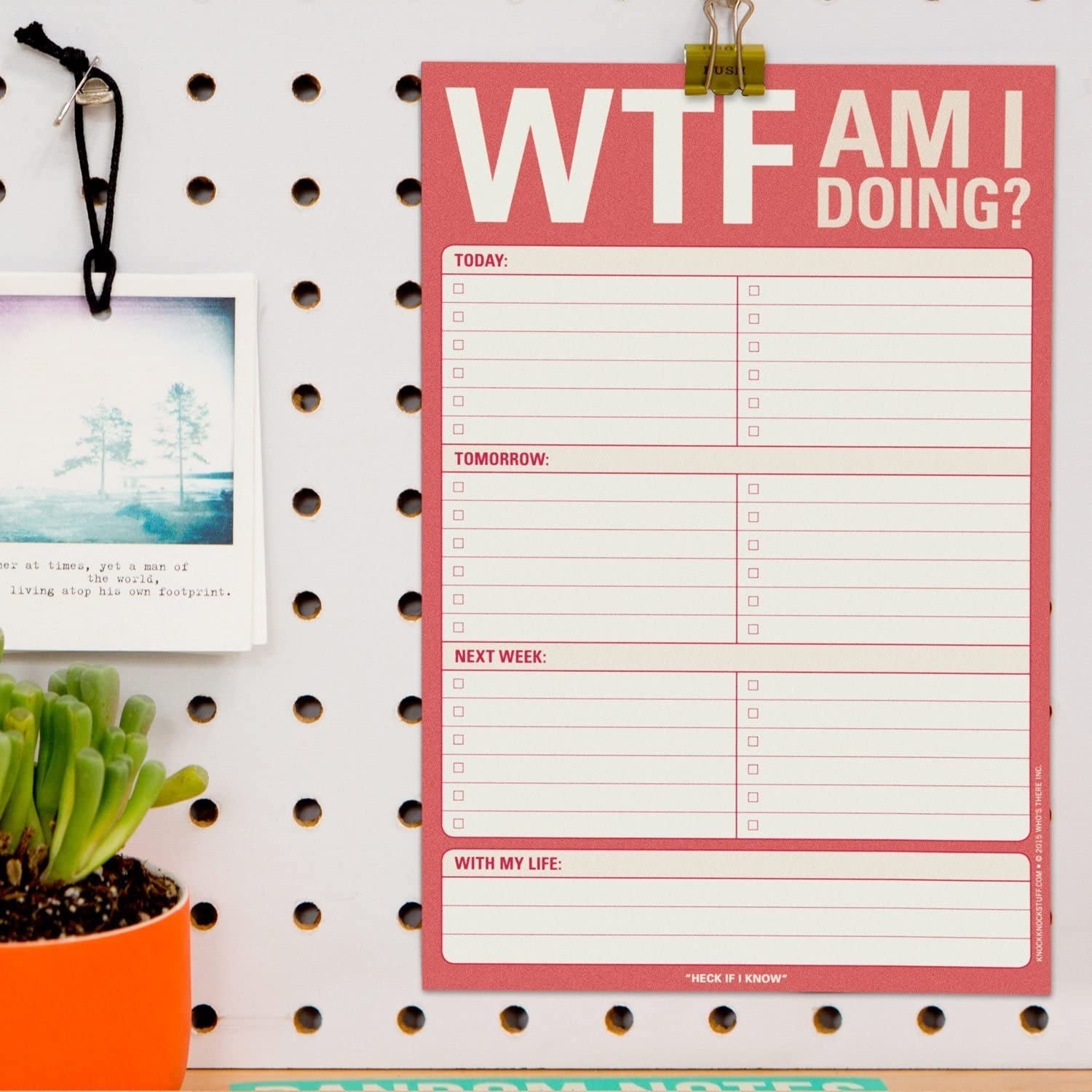 A to-do list hanging on an office wall