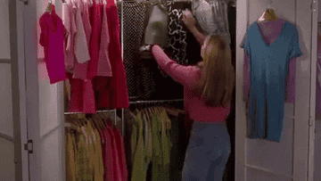 Cher Horowitz chooses an outfit from her spinning closet.