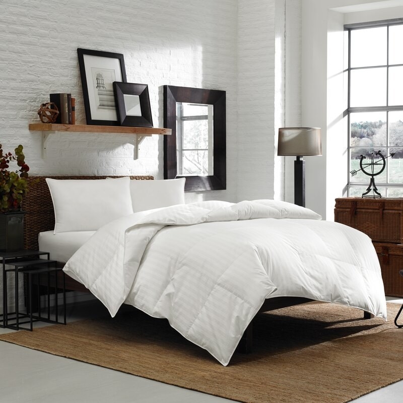 White down comforter on a bed 
