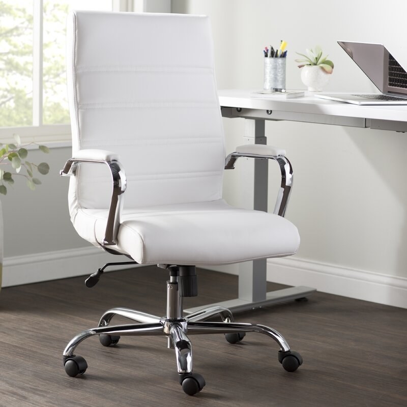 Swivel chair with a white upholstery 