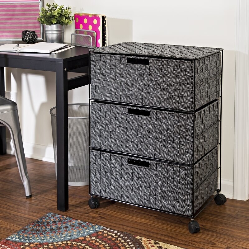 The black metal frame cart with grey woven drawers