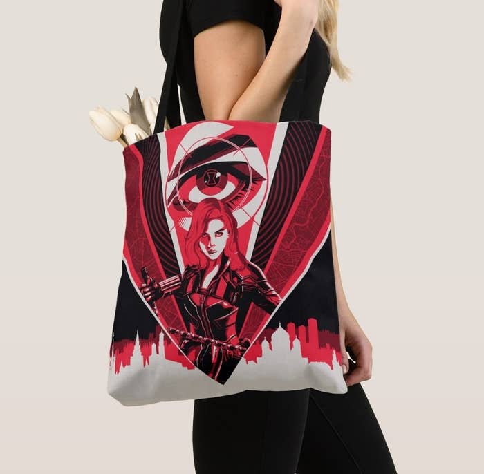 A black, white, and red all over image of Black Widow on a tote bag