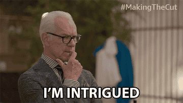 GIF of Tim Gunn sying &quot;I&#x27;m intrigued&quot;