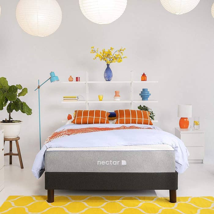 Product photo showing the Nectar mattress styled in a bed room 