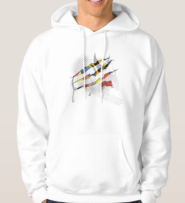 Model wearing a white hooded sweatshirt with blue and yellow animated Wolverine slived through and the &quot;Snikt&quot; sound effect