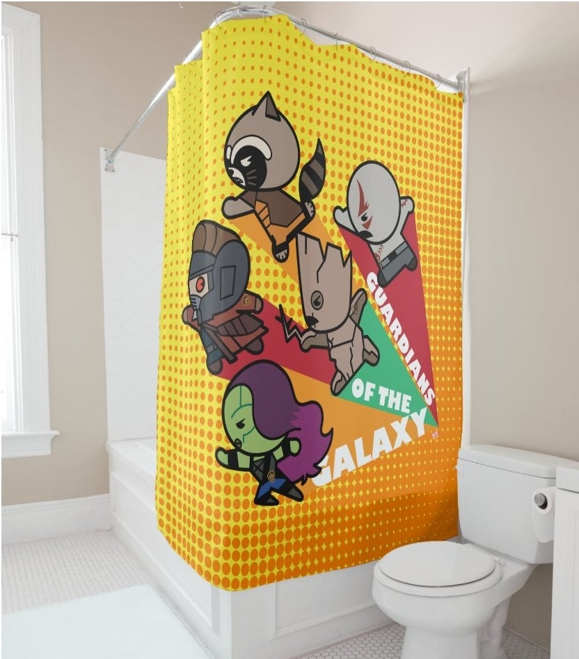 A bright yellow and orange shower curtain with cut versions of the Guardians of the Galaxy
