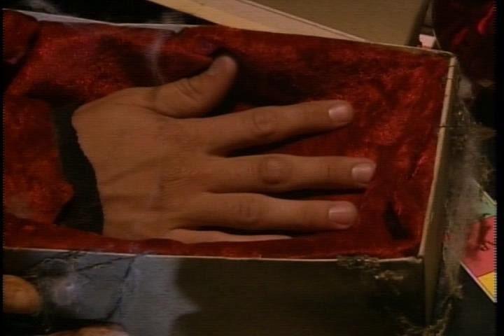 a severed hand in a box