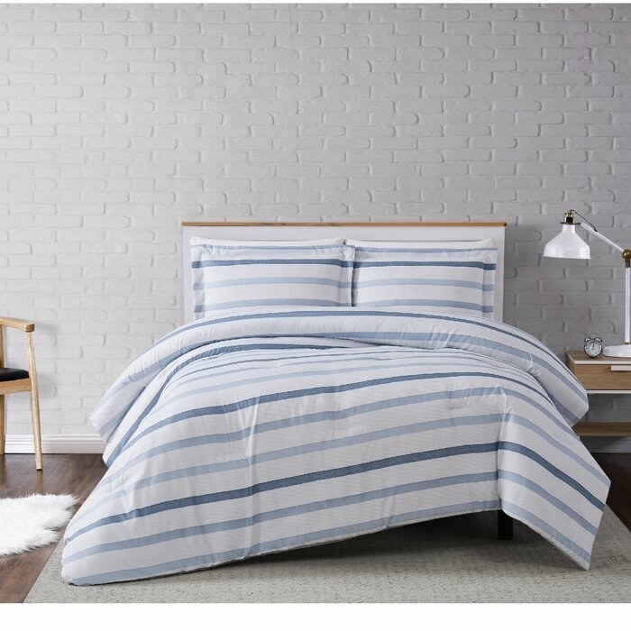 The Bova Soft Waffle Stripe Comforter Set on a bed