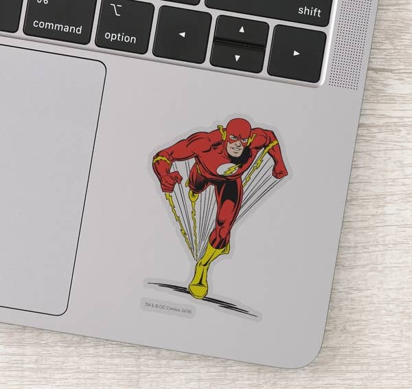 Sticker of the Flash in classic red and yellow costume on a laptop