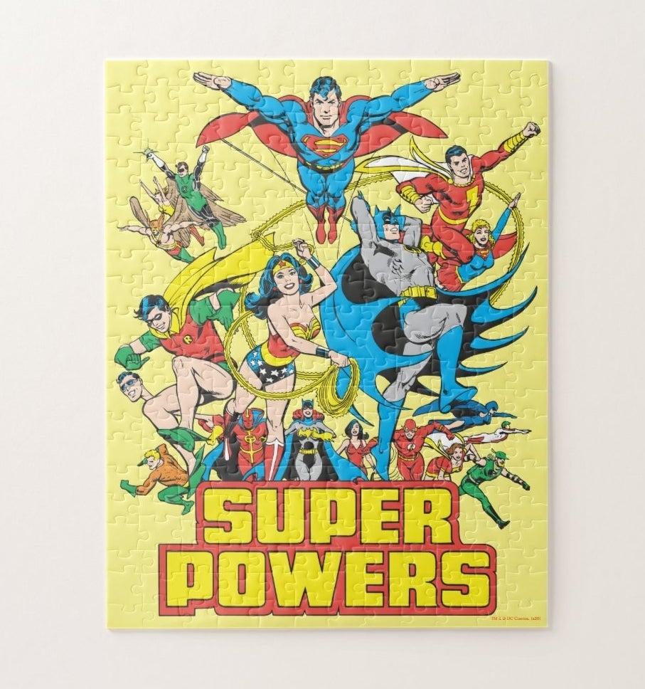 A yellow Super Powers puzzle featuring all the classic DC super heroes
