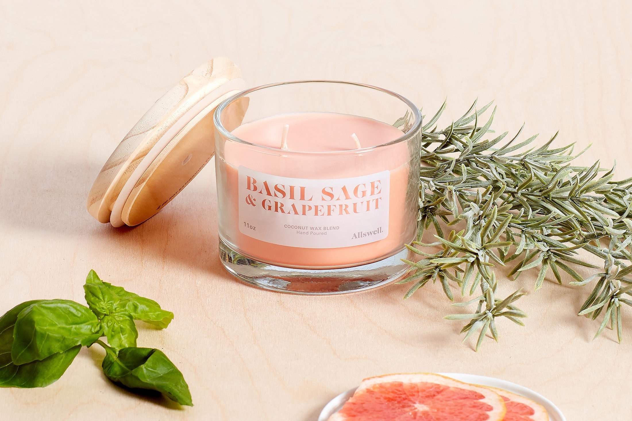 The double wick candle in basil, sage, and grapefruit scent