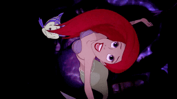 Ariel swims towards the surface.