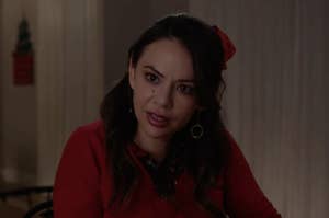 Janel Parrish wearing a holiday bow