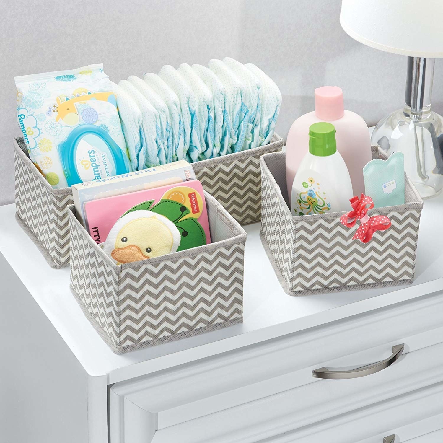 Two square and one rectangular chevron printed storage boxes