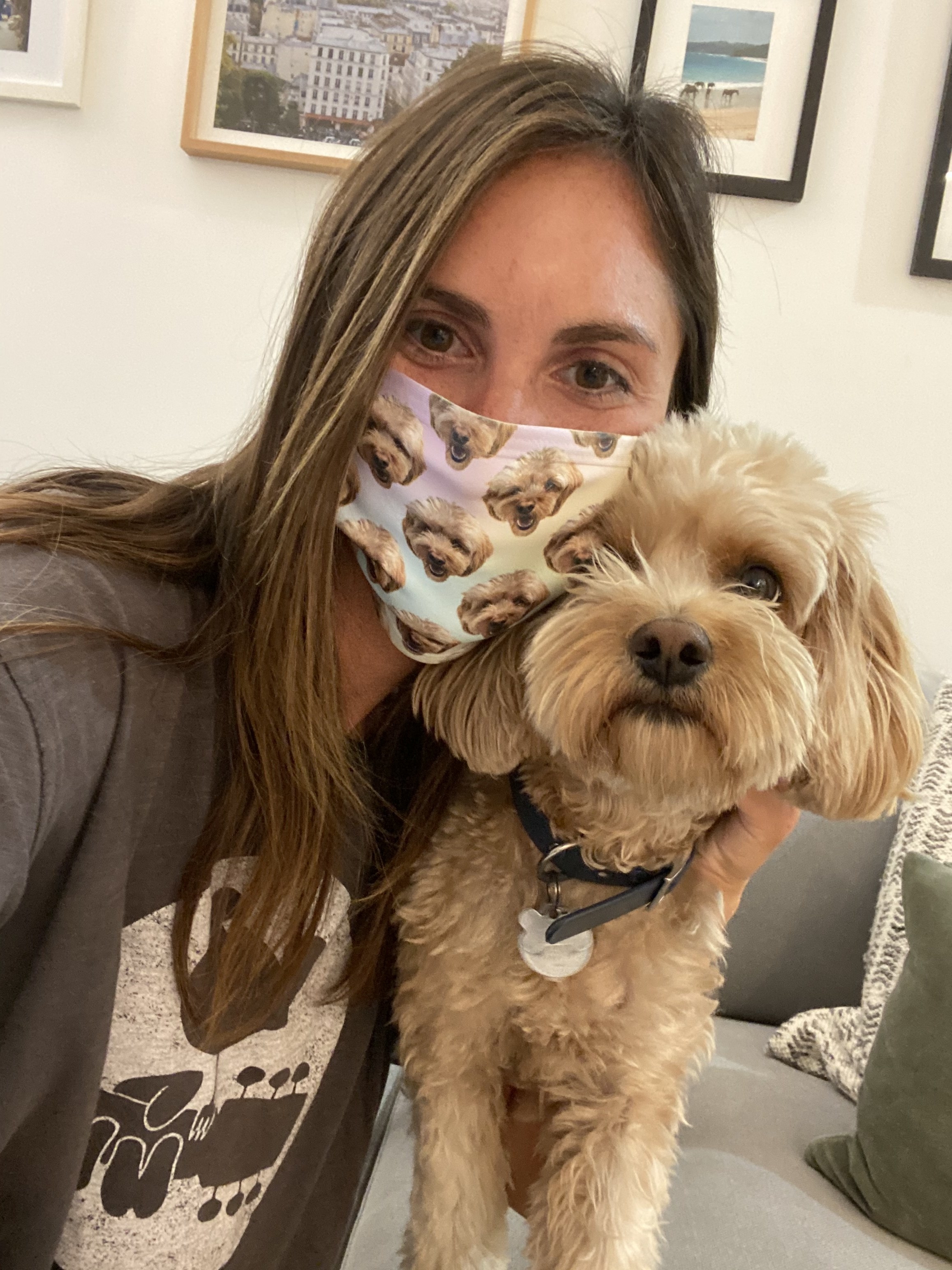 Me posing with my dog while wearing my face mask with his photo on it.