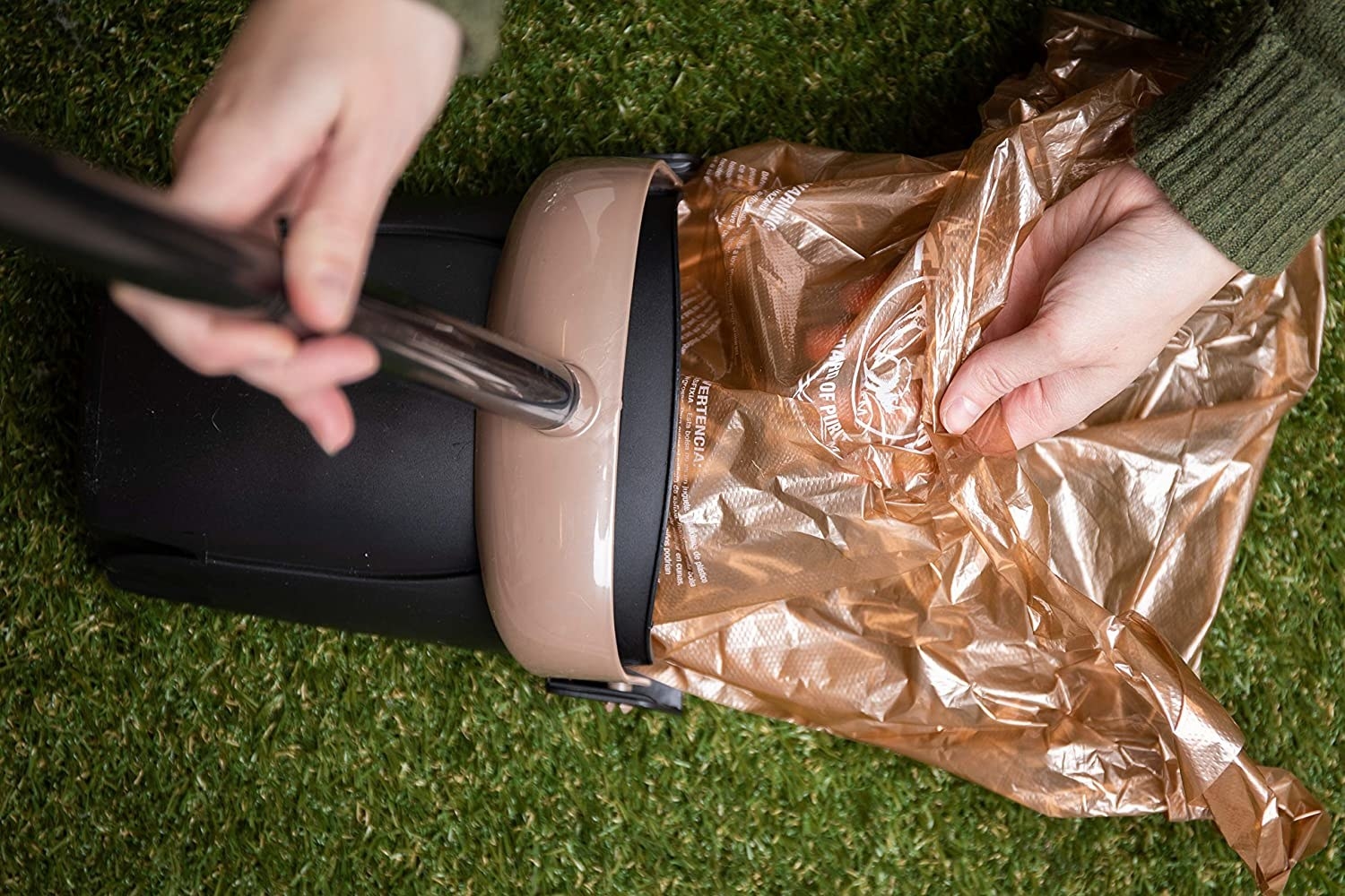 A model tucking a liner bag into the swivel bin