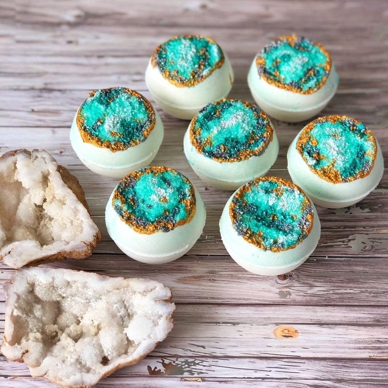 A set of bath bombs with blue and gold geode details
