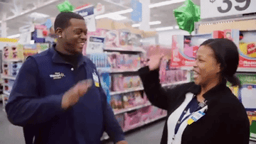 Two Walmart employees high-fiving