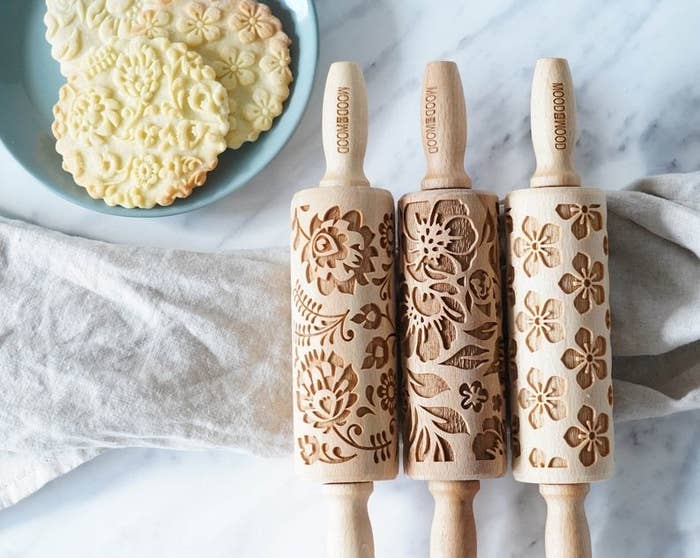 Three mini rolling pins with assorted floral patterns
