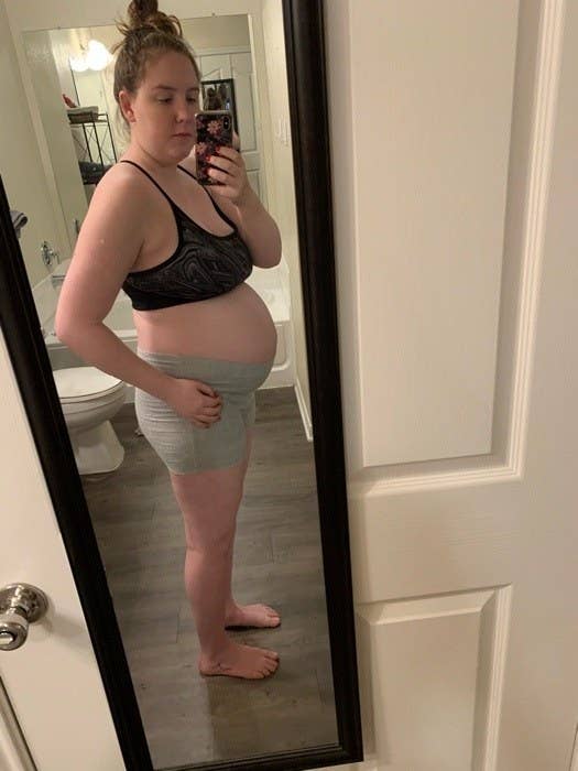 Mirror selfie of mom in bra.