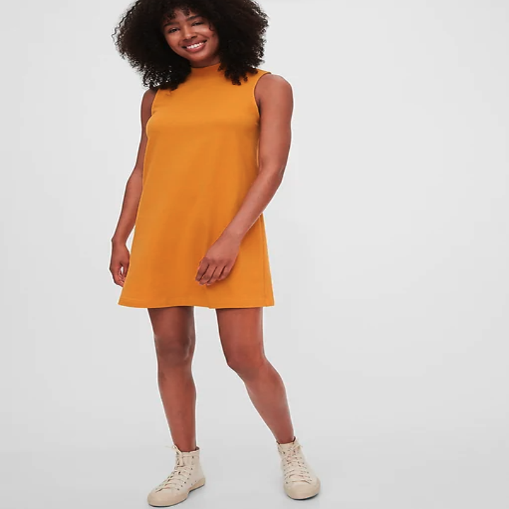 The yellow dress hits mid-thigh